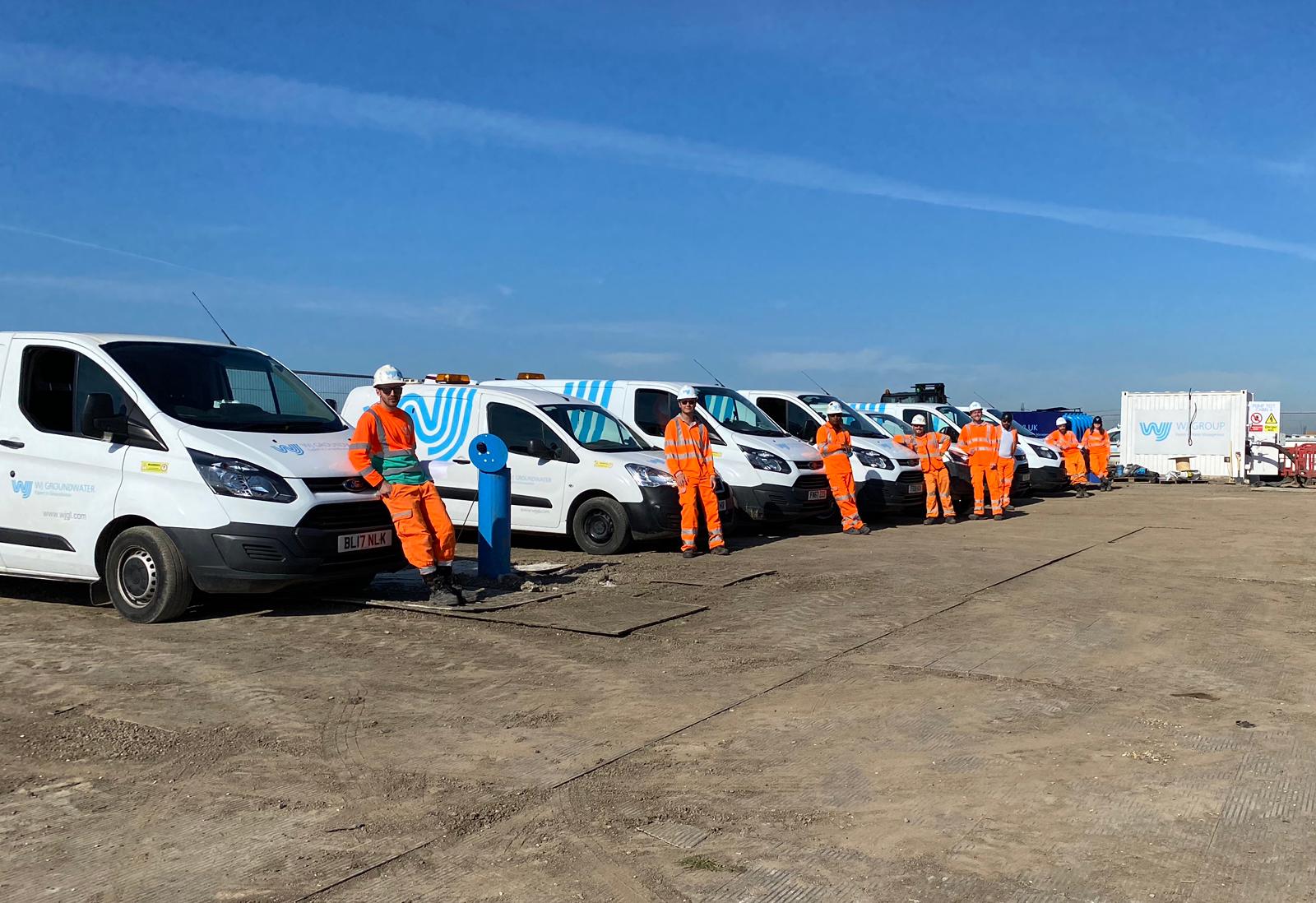 WJ UK and WJ Group team members on-site with company vehicles, demonstrating our collaborative fieldwork culture and commitment to safety and professionalism. They are experts at global water management.